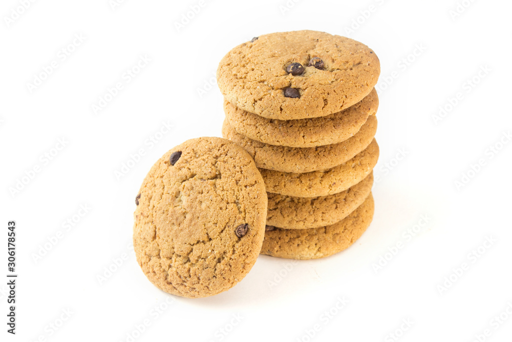 Six oatmeal cookies with chocolate topping on a white plate horizontally and one vertically. Six oatmeal cookies with chocolate topping on a white plate horizontally and one vertically.