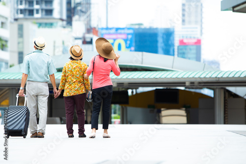 Travel and tourism concept.Group of senior people traveling in the city at Thailand