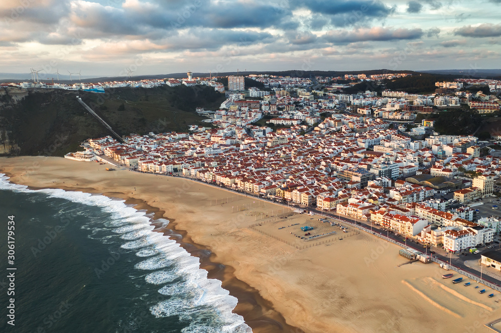 tourist resort town sea or ocean with a clean sand beach, travel Nazare Portugal europe
