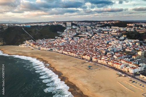Obraz na płótnie tourist resort town sea or ocean with a clean sand beach, travel Nazare Portugal europe w salonie