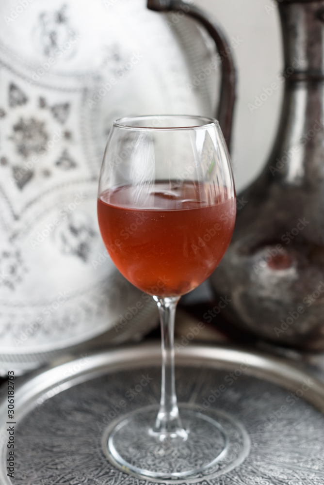 Iced Rosehip Drink. Light Metal Background. Iced Rosehip Drink. Light Metal Background.