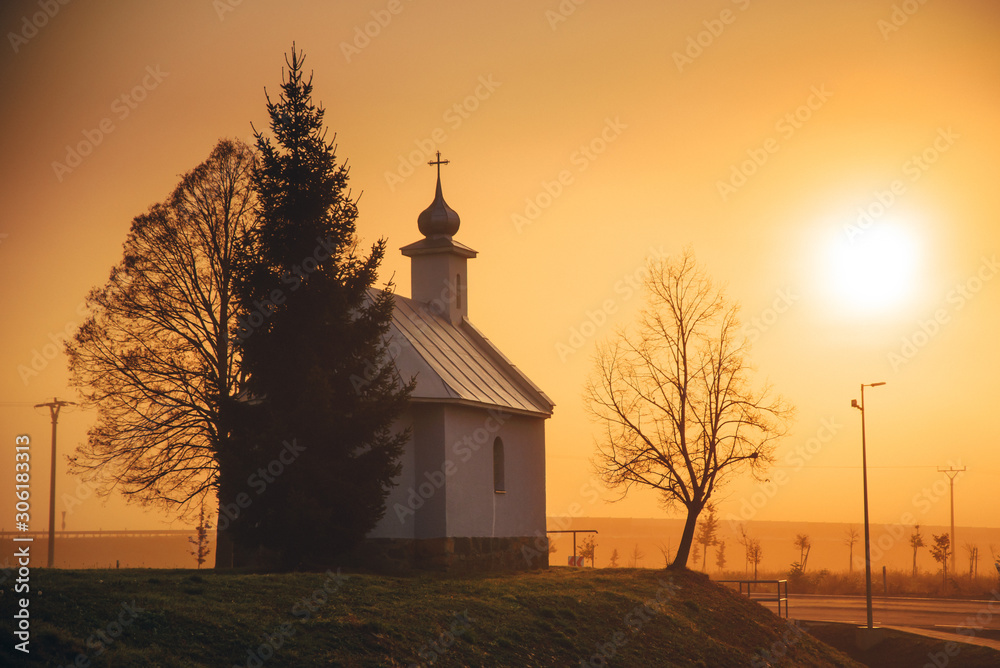Church in sunrise light. Christianity, pray concept photo