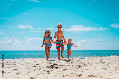 happy kids enjoy beach vacation  boy and girls have fun