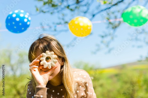 Woman making fun - glasses from home made cakes