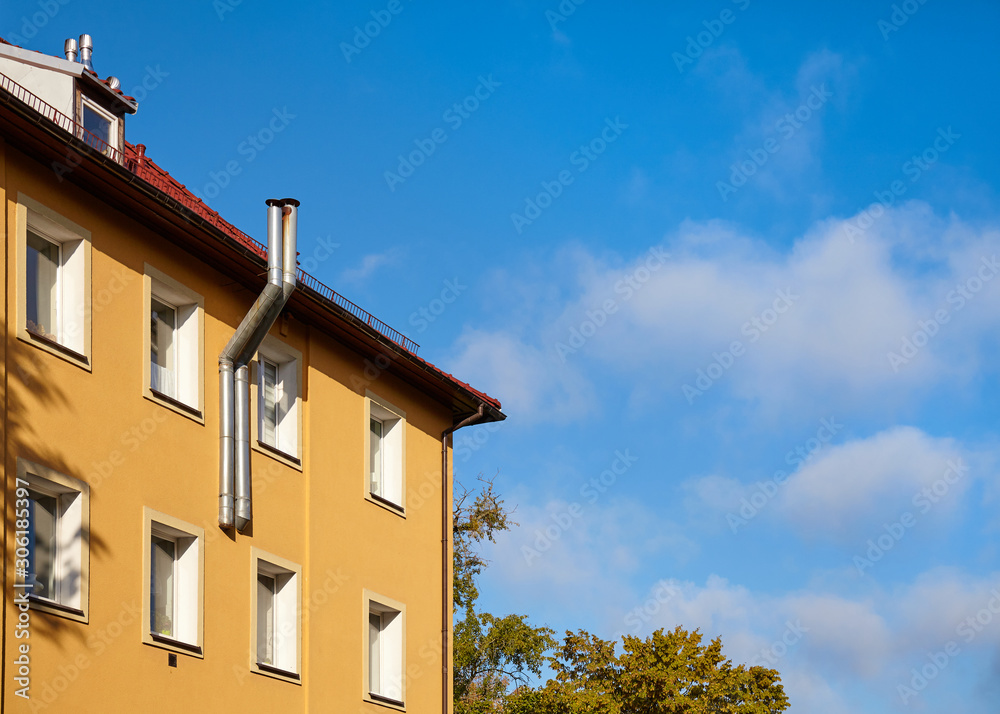 Part of a residential building with heating system pipes Part of a residential building with heating system pipes