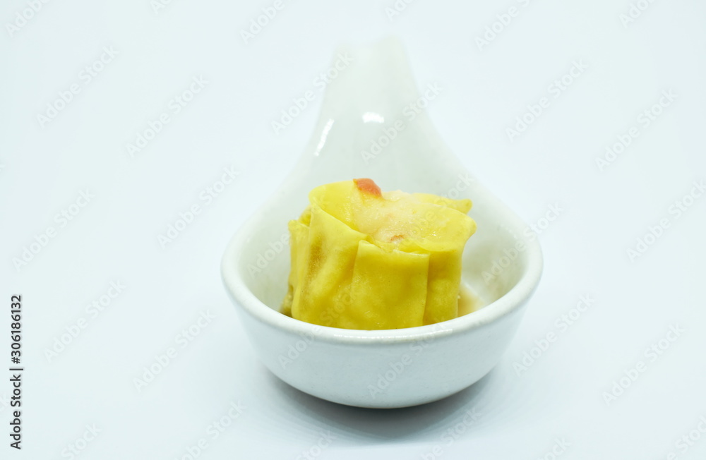 Chinese dumpling stuffed mashed shrimp and pork dressing soy sauce on spoon in white background Chinese dumpling stuffed mashed shrimp and pork dressing soy sauce on spoon in white background