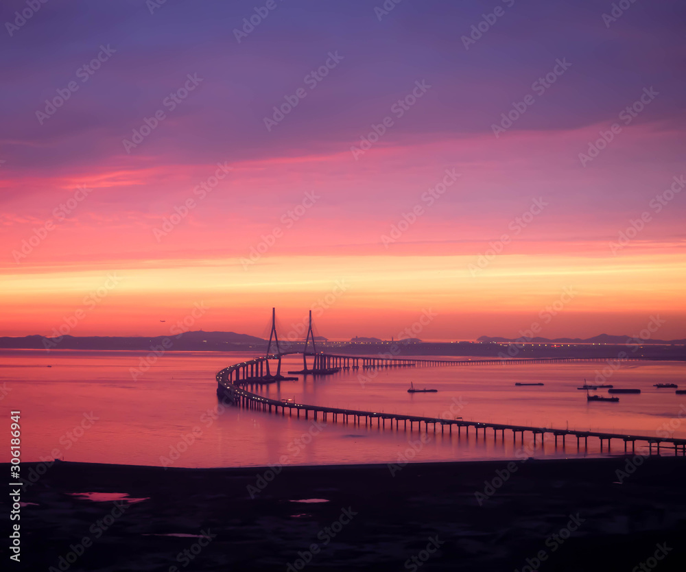 Sun setting over the Incheon Airport Bridge in South Korea