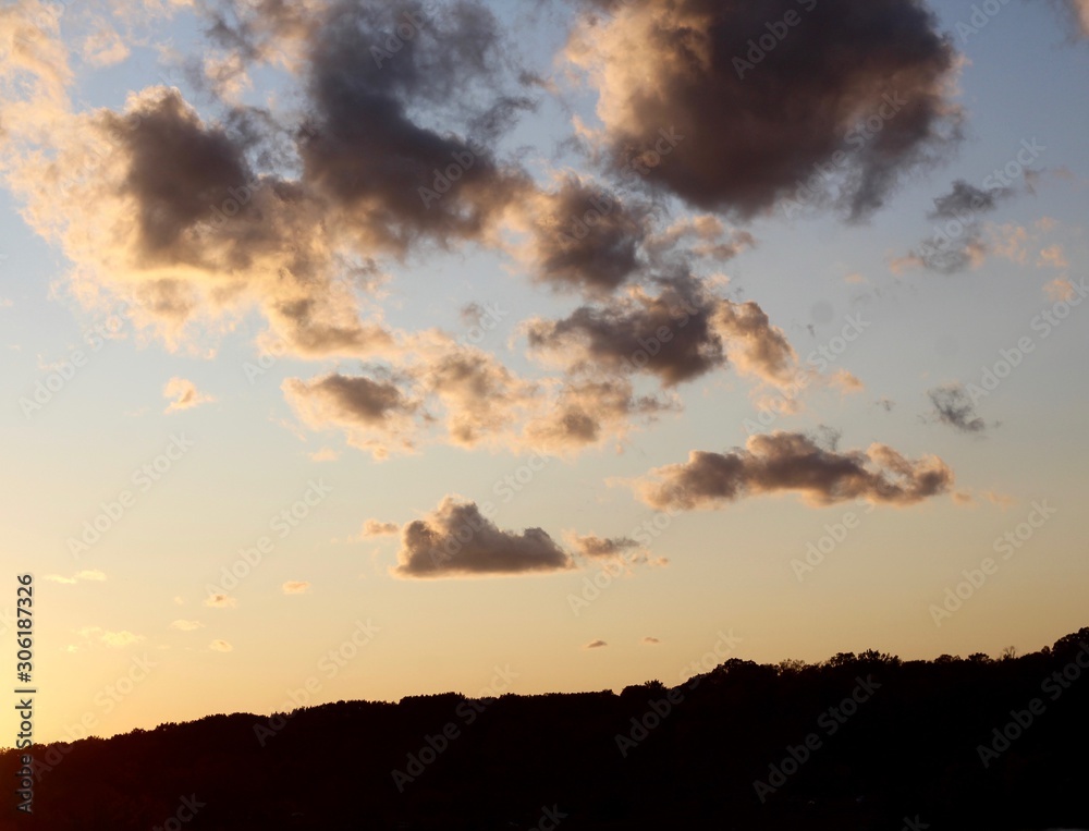 Fototapeta premium The clouds over the landscape in a evening sky.
