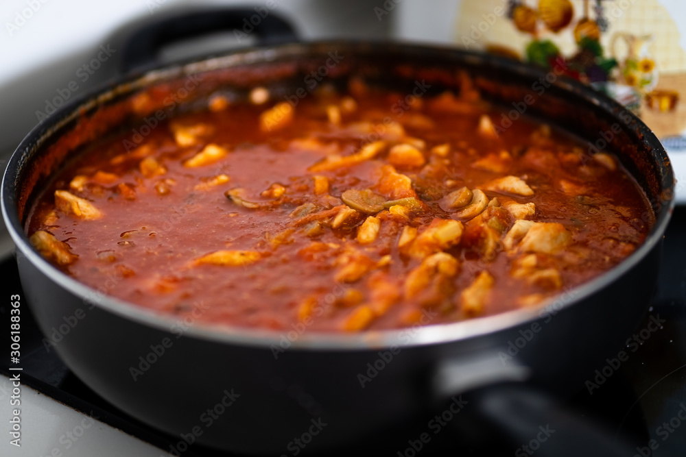 Chicken and mushroom sauce, cooked to combine with Italian pasta Chicken and mushroom sauce, cooked to combine with Italian pasta