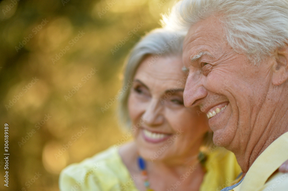 Portrait of happy senior woman and man in park Portrait of happy senior woman and man in park