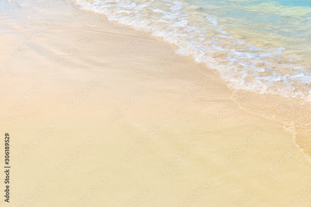 Soft wave of ocean on sandy beach.Empty tropical sea and sand background.Summer Holiday,Vacation,Day off,Travel Concept.Copy space empty blank for text.