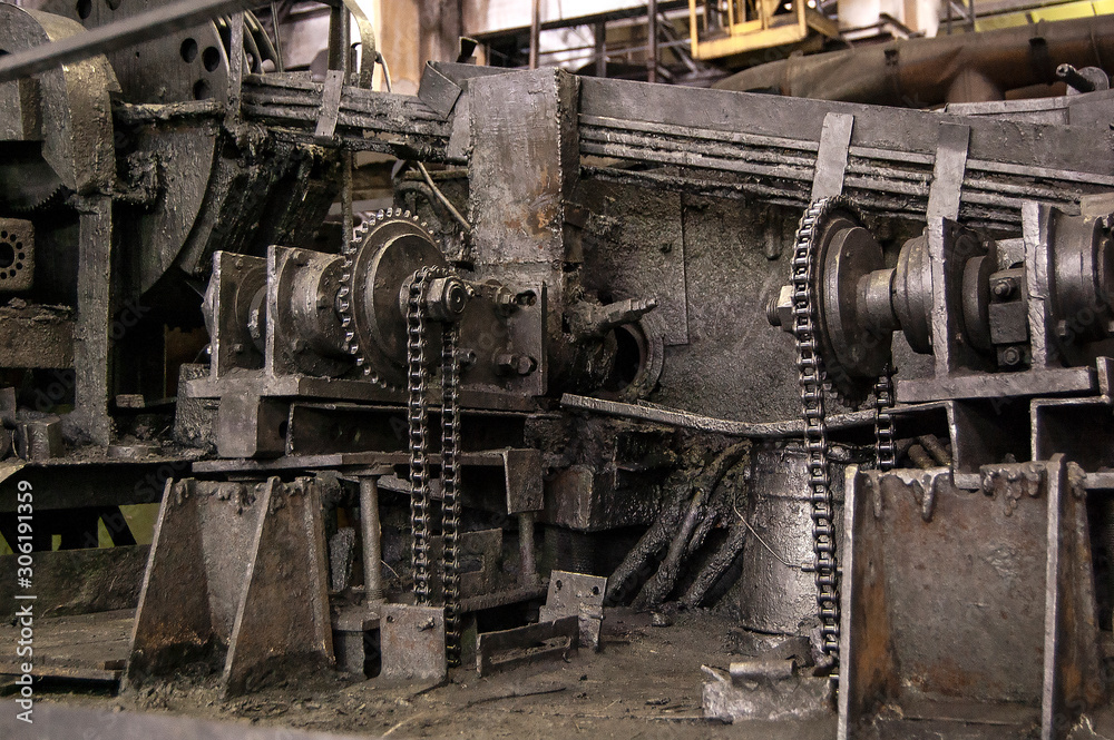 pipes machinery and steam turbine at plant Old gears rust chain oil