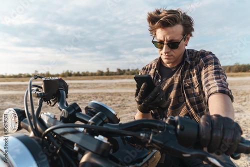 Biker on bike outdoors at the desert field