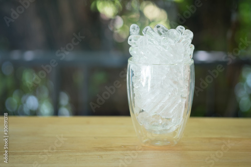 Ice tube in empty glass