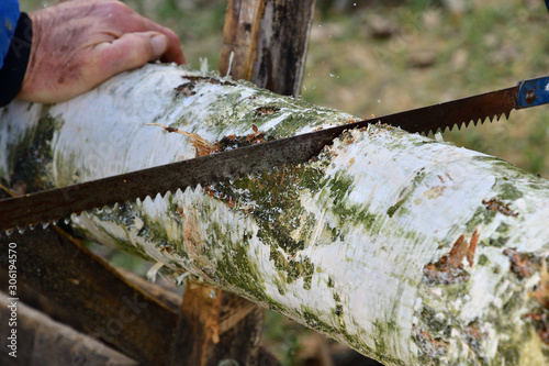 Detail of a wood sawing traditionally in the village