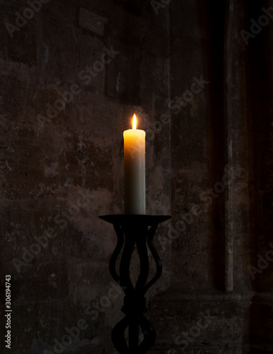 Candle Burning in a Church. Spiritual and Religious Concept © ArtmediaworX