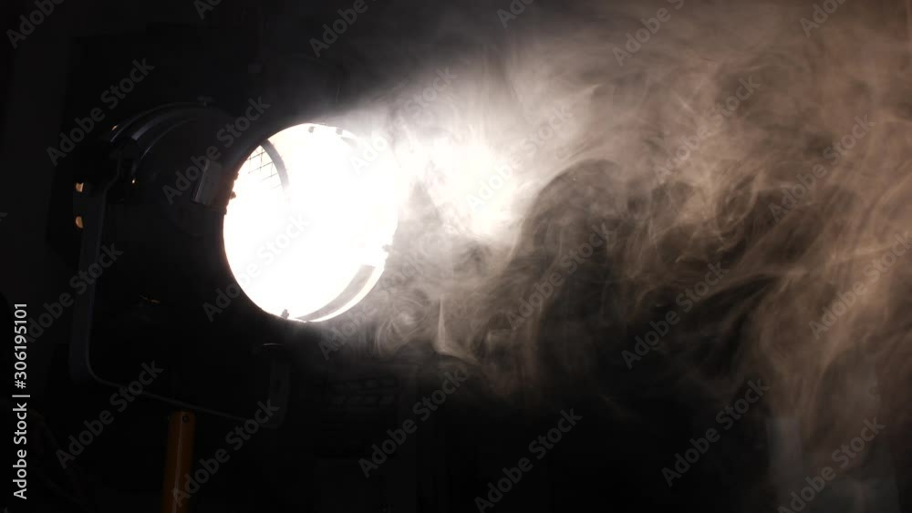 Turning a spotlight in a stage