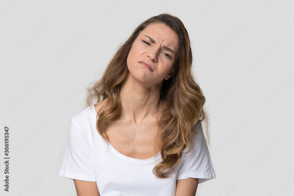 Unhappy tired young woman with pout lips feeling upset Unhappy tired young woman with pout lips feeling upset