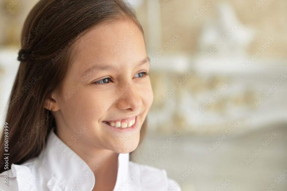 Close up portrait of emotional little girl in white blouse posing at home Close up portrait of emotional little girl in white blouse posing at home