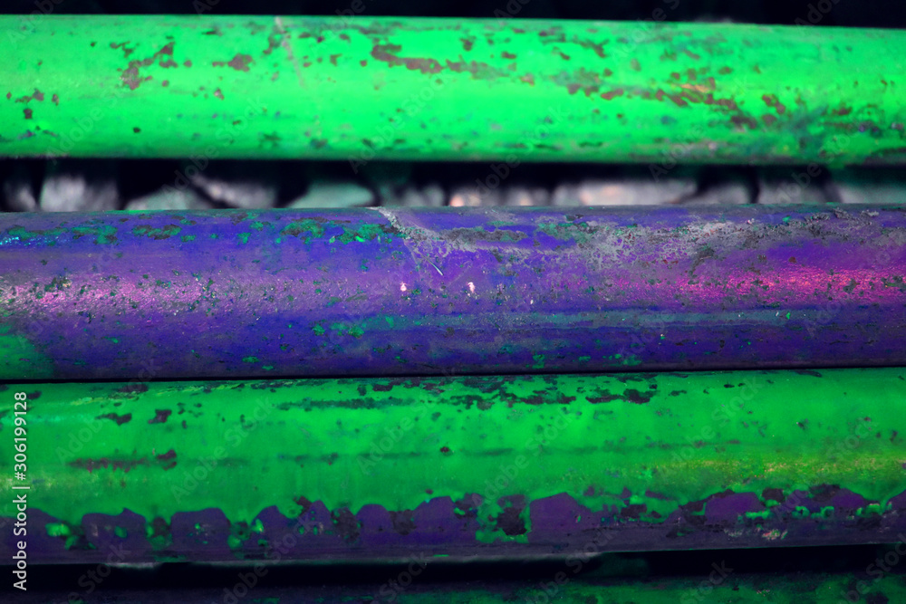 Fototapeta premium metal pipes with a rusted texture violet-green fragment
