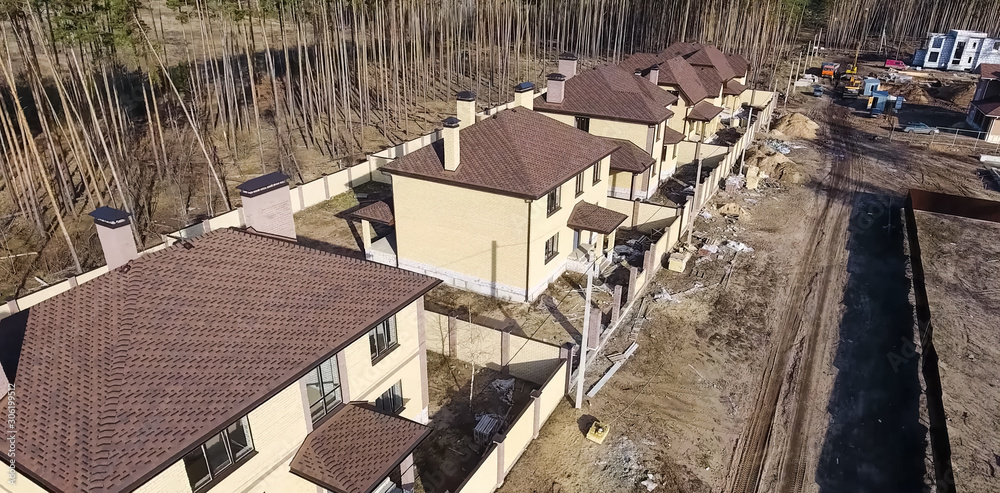 Bituminous tile for a roof. House with a roof from a bituminous tile. a roof from a bituminous tile. Moder Bituminous tile for a roof. House with a roof from a bituminous tile. a roof from a bituminous tile. Moder