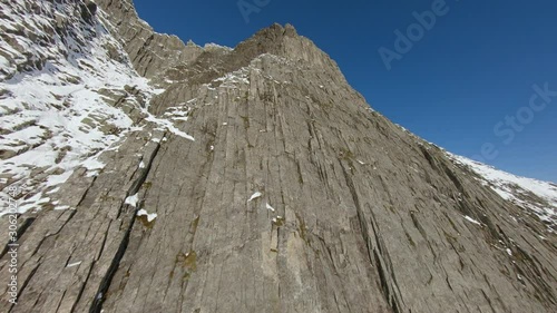 Aerial footage of flying up a mountain wall