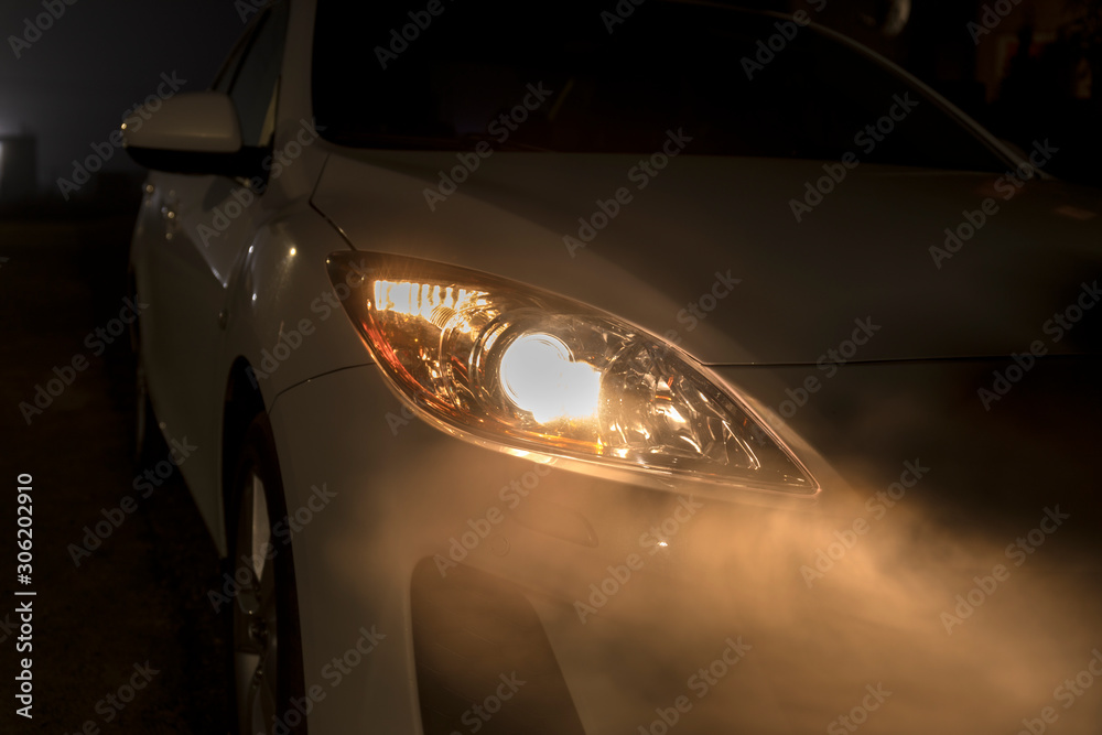 Dangerous Road Conditions. Night Time Driving in Fog. Abstract of car headlights in the fog. Dangerous Road Conditions. Night Time Driving in Fog. Abstract of car headlights in the fog.