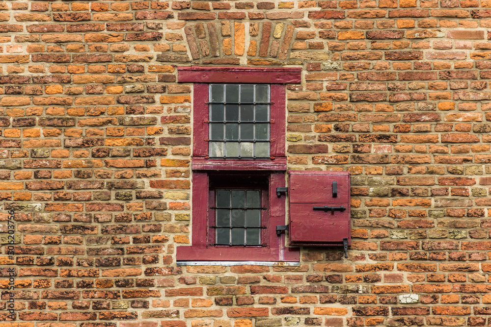 Small window with shutter medieval castle wall background texture