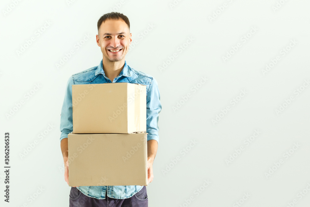 Deliveryman holding cardboard box isolated on white background Deliveryman holding cardboard box isolated on white background