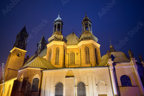Towers of the Gothic Catholic cathedral during the night in Poznan.