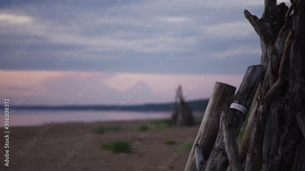 Wooden object in the foreground on the beach - Beautiful 4K nature sunset stabilized shots - Great for holidays traveling background - Moody dawn vivid landscape views Wooden object in the foreground on the beach - Beautiful 4K nature sunset stabilized shots - Great for holidays traveling background - Moody dawn vivid landscape views