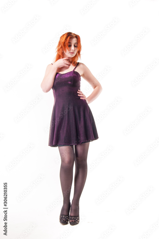 young woman in tight black dress on white background