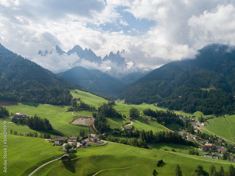 Aerial view of the landscapes of the village Funes in Dolomites mountain range, South Tyrol, Italy