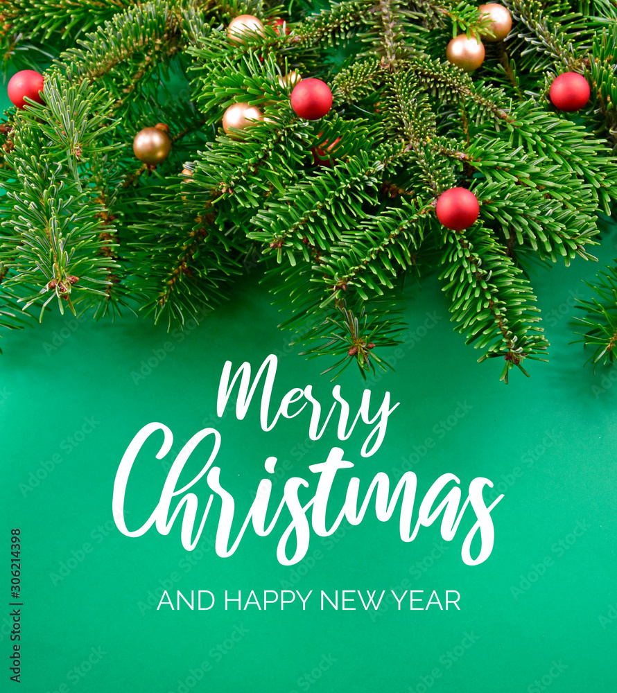 Merry Christmas and Happy New Year Sign with spruce branch. Christmas green background with ornate spruce branch stock images. Elegant holiday background. Green Christmas greeting card Merry Christmas and Happy New Year Sign with spruce branch. Christmas green background with ornate spruce branch stock images. Elegant holiday background. Green Christmas greeting card