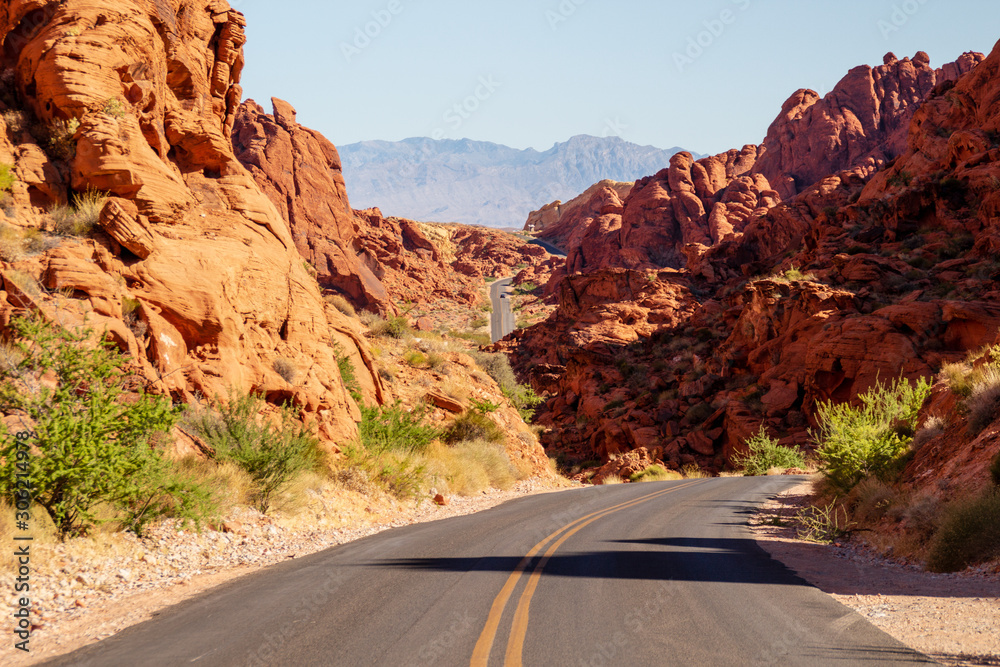Scenic drive road runs through it in the Valley of Fire State Park near Las Vegas, Nevada. Scenic drive road runs through it in the Valley of Fire State Park near Las Vegas, Nevada.