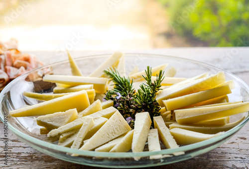 cheese wedges on a plate slices of pecorino