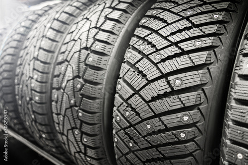 new winter studded tires in store. sale of winter wheels. ice, seasonal change of tires.