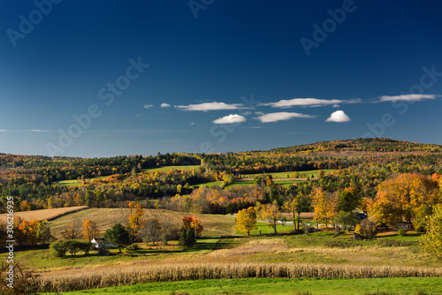 View of colorful Fall countryside farms and Jennison Mountain from Peacham Vermont photo