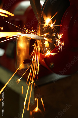 sharpening a steel tool on a machine