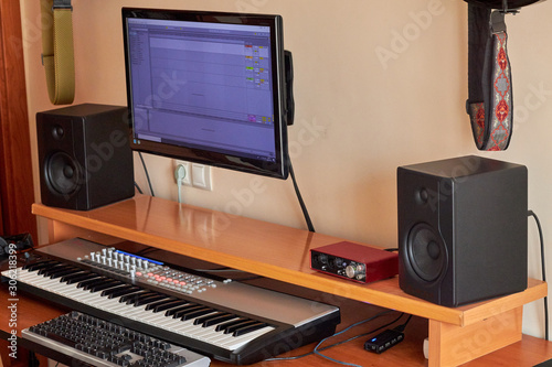 Audio Home Studio equipped with midi keyboard, monitors and sound card