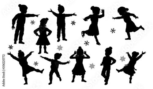 A set of children in silhouette playing having fun in Christmas or winter cold weather clothing