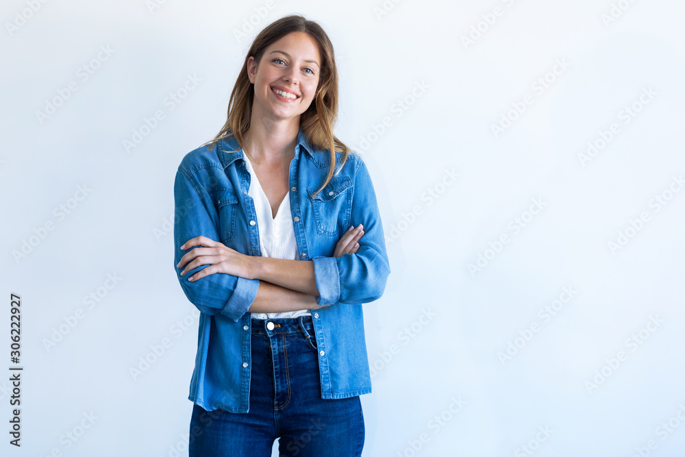 Happy young woman with perfect smile looking at camera. Isolated on white background.