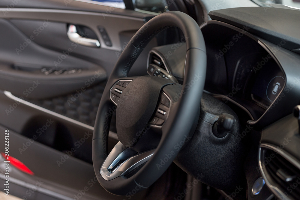 Interior and steering wheel of new modern car.