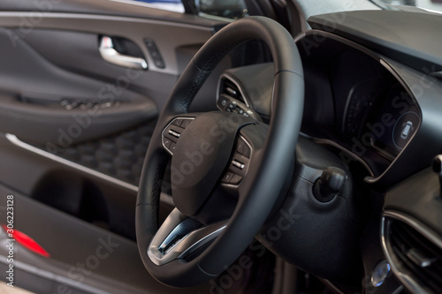 Interior and steering wheel of new modern car. © tikhomirovsergey
