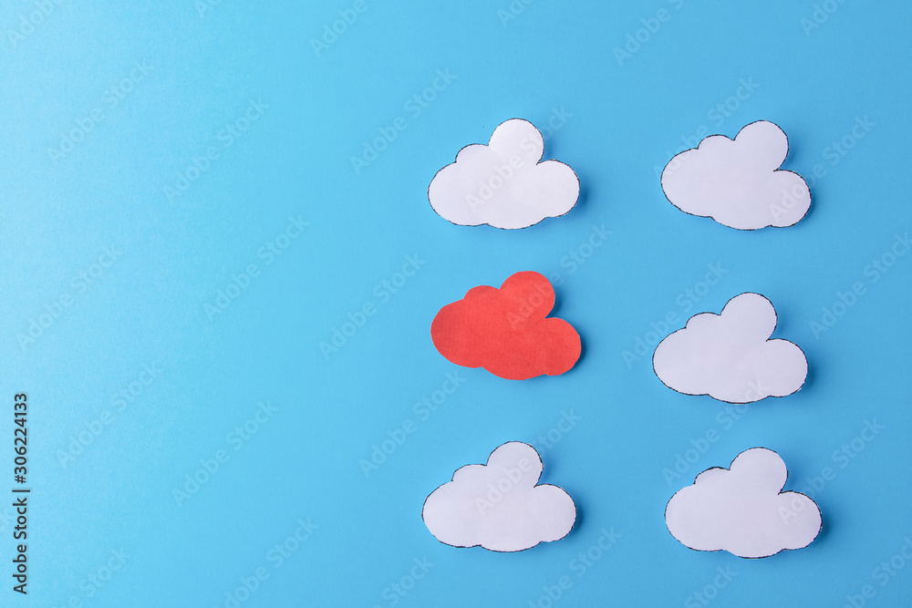White paper clouds on blue background. Cloud computing concept. Copy space