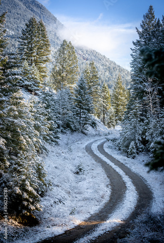 Off road trail in snowy mountains