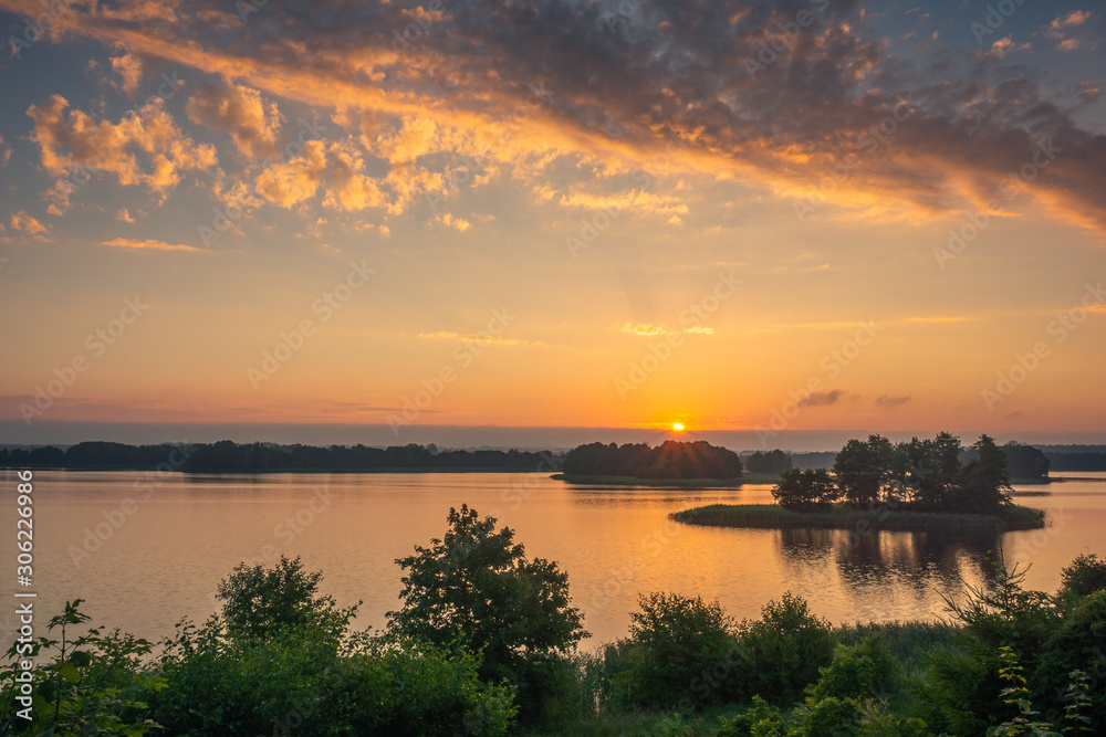 Sunrise over the Soltmany lake near Kruklanki, Masuria, Poland