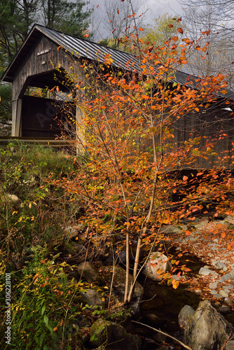 Sunny break on Pine Brook Covered Bridge Waitsfield Vermont in the Fall photo