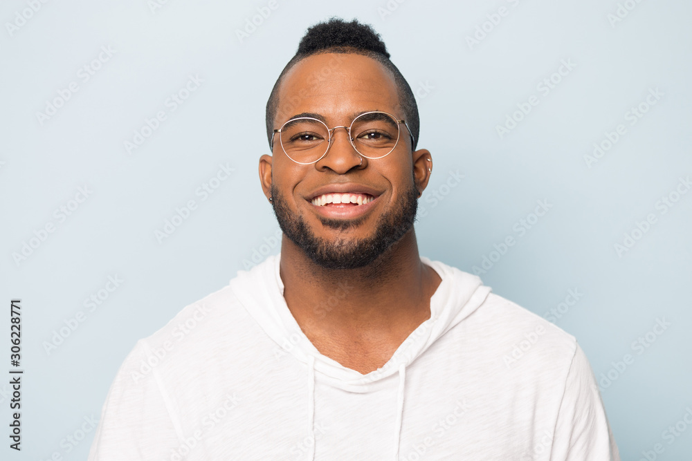 Head shot happy African American man with wide toothy smile Head shot happy African American man with wide toothy smile