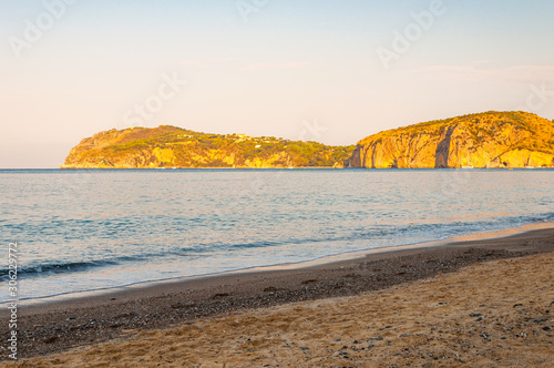 Morning sand beach on Tyrrhenian sea coast with mountains on background in Cilento Vallo di Diano and Alburni National park in province of Salerno, Italy